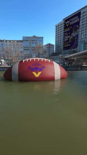 Giant Football Floats Along Danube Canal in a fake-out-of-home ad of Vienna Vikings