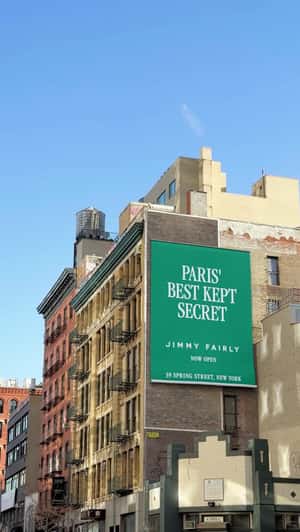 Banner Announcement of New Store in a fake-out-of-home ad of Jimmy Fairly