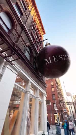 Giant Ornament Breaks to Reveal Gifts in a fake-out-of-home ad of Meshki