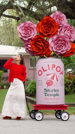 Giant Roses in Can Bloom in a fake-out-of-home ad of Olipop