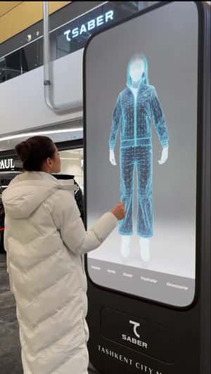 Interactive Screen Dispenses Outfit in a fake-out-of-home ad of 7saber