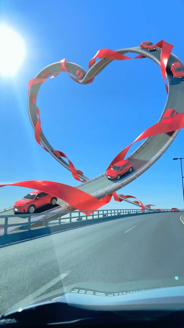 Red Cars Drive Along Heart Loop in a fake-out-of-home ad of Lexus