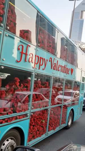 LHC Double-Decker Bus Filled with Red Roses in a fake-out-of-home ad of Loving Haute Couture