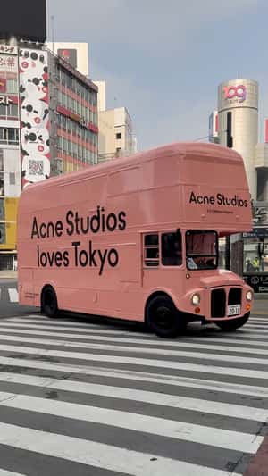 Double-Decker Bus in Shibuya Crossing in a fake-out-of-home ad of Acne Studios