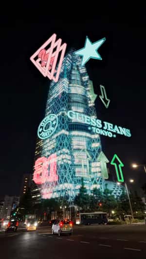 Light Display Takes Over Cocoon Tower in a fake-out-of-home ad of Guess Jeans