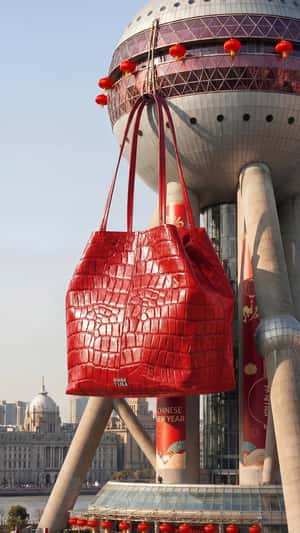 Giant Handbag in Shanghai in a fake-out-of-home ad of Bimba y Lola