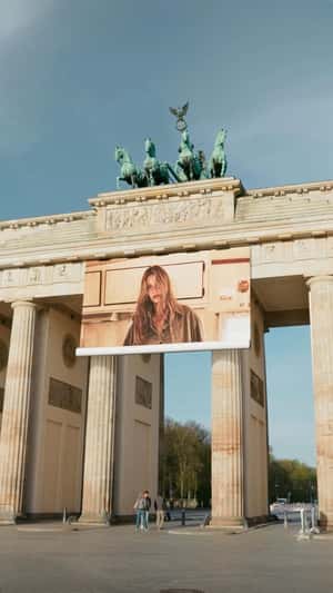 Marc O’Polo Banner Unfolds at Brandenburg Gate in a fake-out-of-home ad of Marc O'Polo