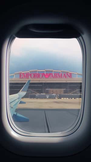 Hangar Sign Lights Up Pink in a fake-out-of-home ad of Armani Beauty