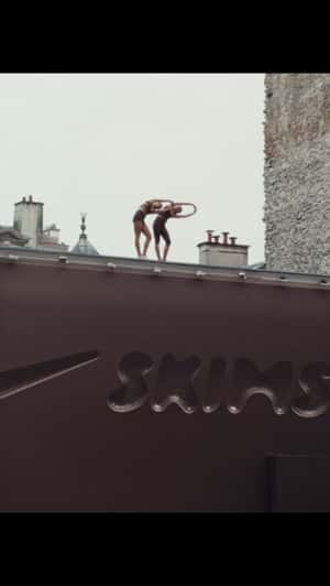 Women Stretch Atop x Skims Facade in a fake-out-of-home ad of Nike