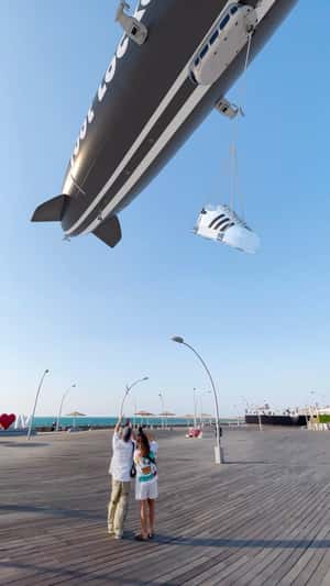 Giant Blimp Carries Giant Shoe in a fake-out-of-home ad of Foot Locker