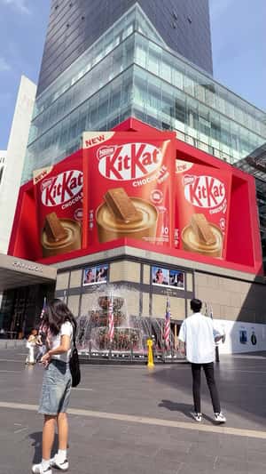 Giant Chocolate Drinks Take Over Landmarks in a fake-out-of-home ad of KitKat