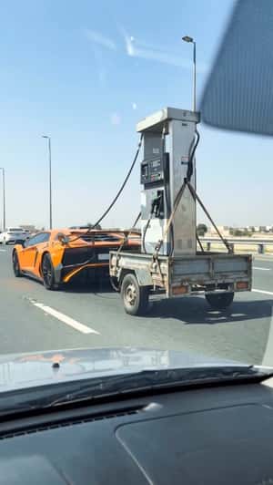 Lamborghini Pulls Fuel Dispenser in a fake-out-of-home ad of Automax