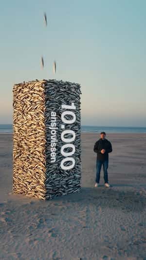 Stacks of Fish Form Pillars in a fake-out-of-home ad of Plnktn