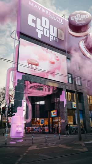 Maybelline Jars Flow Through Clear Tubes at DM in a fake-out-of-home ad of Maybelline New York