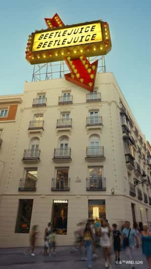 Beetlejuice Beetlejuice Glowing Signage in a fake-out-of-home ad of Bershka