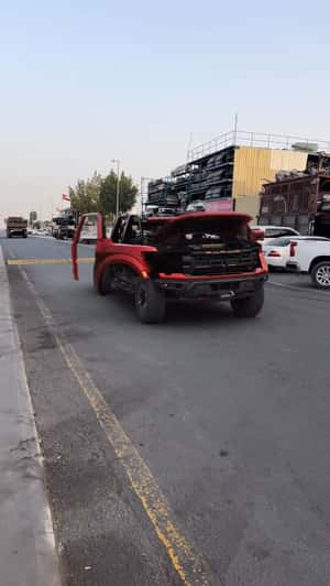 Ford Raptor Forms from Rolling Wheels in a fake-out-of-home ad of Automax