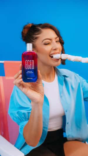 Giant Dessert Scene with Egeo Bottle in a fake-out-of-home ad of O Boticário