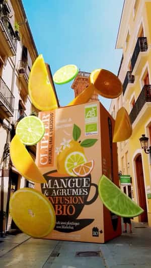 Giant Box Floats with Fruit Slices in a fake-out-of-home ad of Clipper