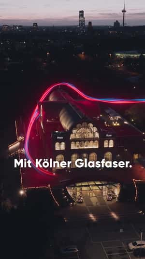 Light Trail Approaches Through Flora Köln in a fake-out-of-home ad of NetCologne