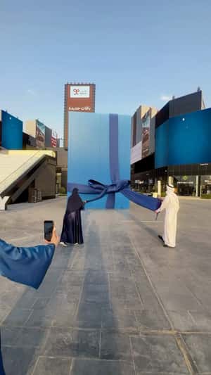 Unboxing Giant Bottle in fake-out-of-home ad of Comfort