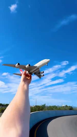 Airbus Turns Into Handheld Plane in a fake-out-of-home ad of Qantas