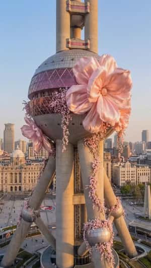 Giant Flowers Bloom on Oriental Pearl Tower in a fake-out-of-home ad of Moooi