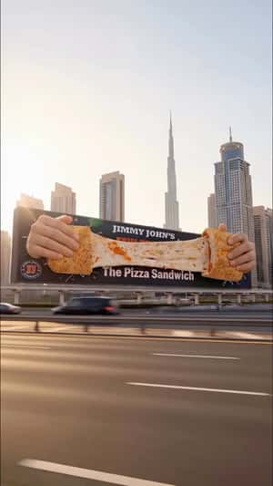 Jimmy John’s Cheese Pull Spans Billboard in a fake-out-of-home ad of Jimmy John's