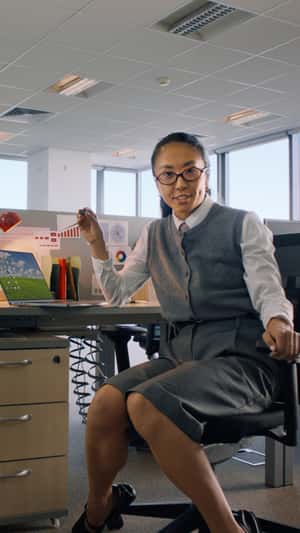 Woman Rides Data Charts Inside Screen in a fake-out-of-home ad of Sandisk