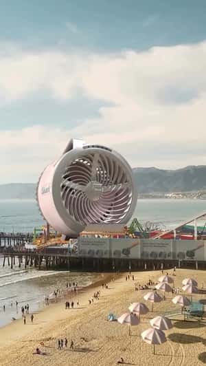 Giant Fan Blows Mist Across Beach in a fake-out-of-home ad of Shark Clean