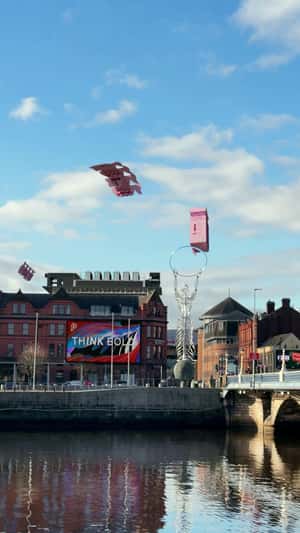 Giant Pink Boxes Land on Bridge in a fake-out-of-home ad of Print Library