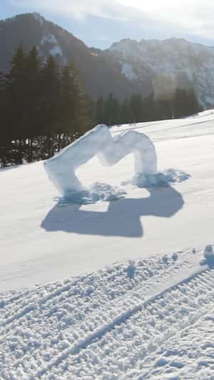 Ice Logo Installation in Baqueira Beret in a fake-out-of-home ad of Muchobambū