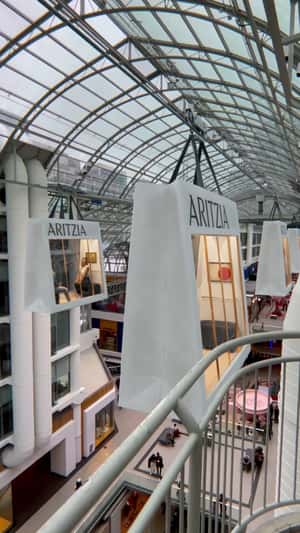 Giant Shopping Bag Cable Cars in a fake-out-of-home ad of Aritzia