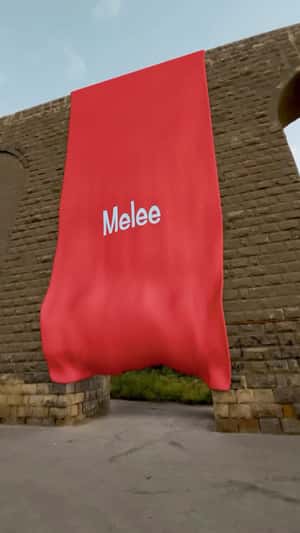 Giant Banner Unfolds on Stone Archway in a fake-out-of-home ad of Melee
