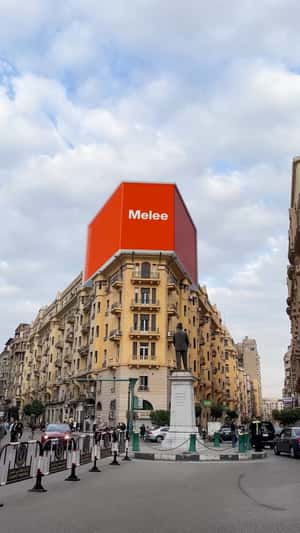 Giant Balloon Letters Float From Billboard in a fake-out-of-home ad of Melee