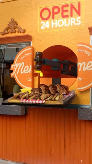Giant Waffle Tray Emerges From Facade in a fake-out-of-home ad of Meme’s Diner