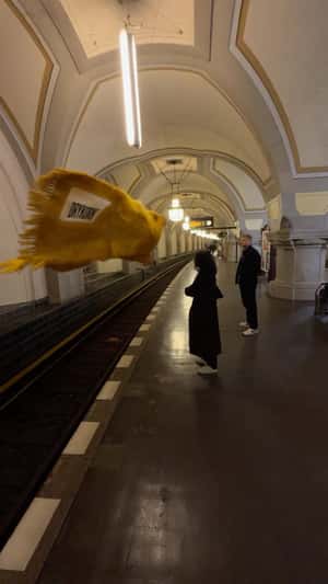 Scarf Flies Above Train Tracks in fake-out-of-home ad of Drykorn