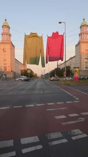 Sweaters Hanging Over Intersection in fake-out-of-home of Drykorn