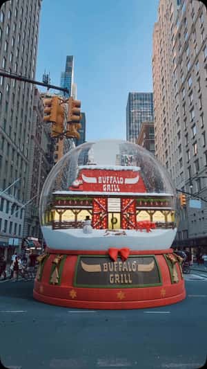 Giant Snow Globe in New York Street in a fake-out-of-home ad of Buffalo Grill