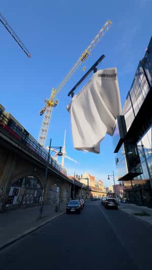 White Underwear Held by Cranes in fake-out-of-home ad of Drykorn