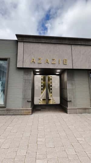 Living Bridal Dresses Walk on Street in a fake-out-of-home ad of Azazie