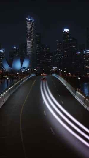 Race Car Speeds Through Marina Bay in a fake-out-of-home ad of Adidas