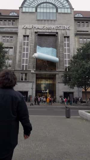 Scarf Unveiled on Facade in Berlin in fake-out-of-home ad of KaDeWe