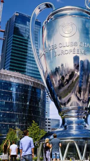 Giant Trophy Bursts With Confetti in a fake-out-of-home ad of Canal+