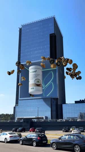 Giant Jar Emerges From Building in a fake-out-of-home ad of Herbalife TV