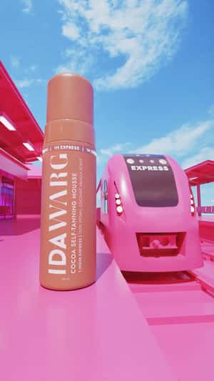 Giant Product Rides Pink Train in a fake-out-of-home ad of IDA WARG Beauty