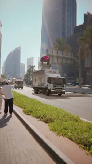 Airplane Seat Emerges From Truck in a fake-out-of-home ad of Eurowings