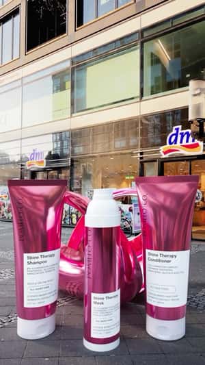 Pomélo+Co Giant Products Emerge From Bag in a fake-out-of-home ad of Pomélo+Co.
