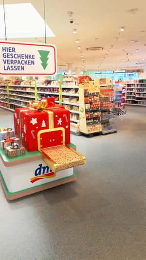 Gift Box Works as Wrapping Machine in a fake-out-of-home ad of DM