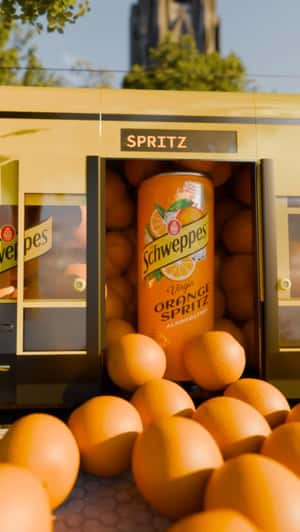 Train Doors Open to Giant Oranges in a fake-out-of-home ad of Schweppes