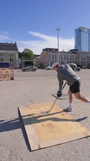 Hockey Puck Knocks Over Giant Blue Van in a fake-out-of-home ad of Veikkaus